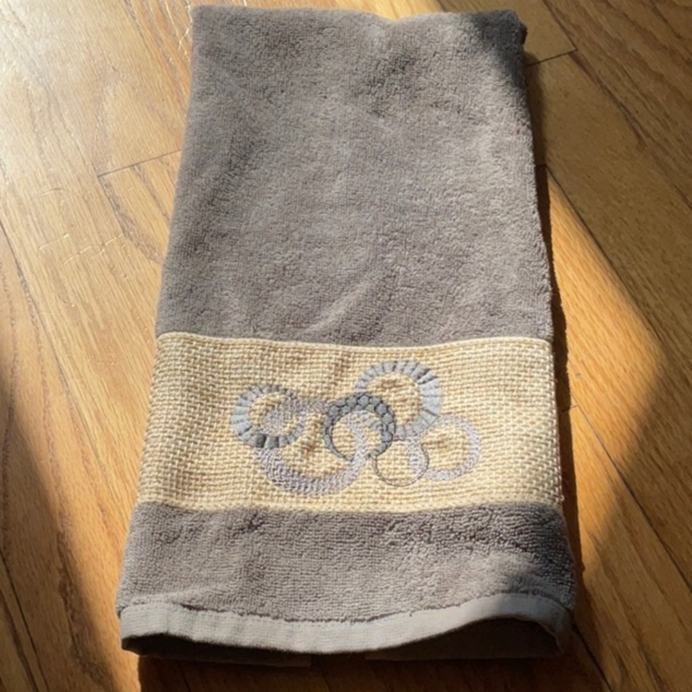 Gray and Tan Towel with Embroidered Design